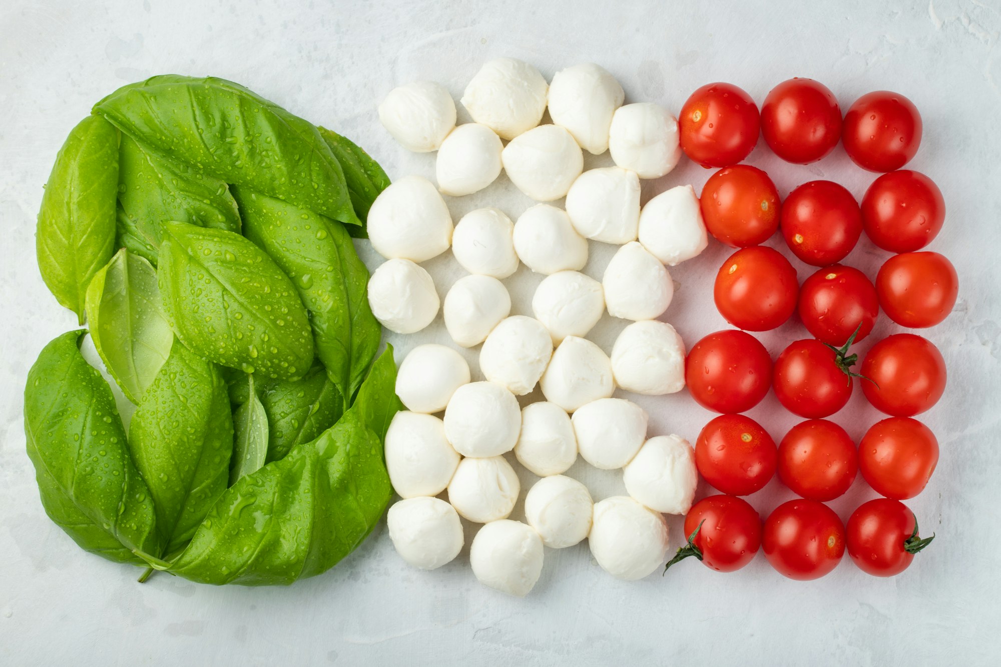 Italian flag made with Tomato Mozzarella and Basil. The concept of Italian cuisine